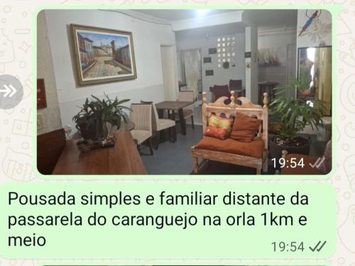 a living room with a couch and a table at Pousada Aconchego in Aracaju