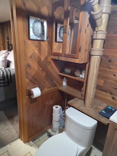 a bathroom with a toilet in a room at Cozy Hideaway in Lewiston