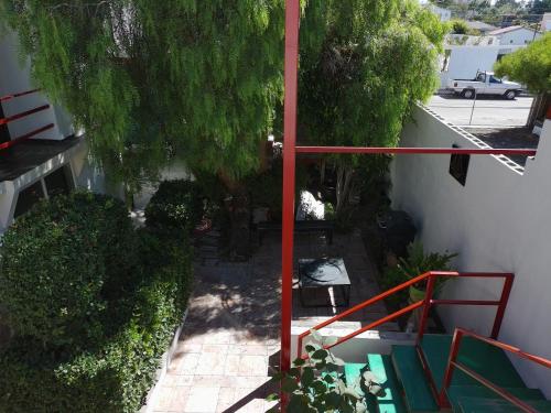 an overhead view of a garden with a red railing at Apartment Rosarito Beach Downtown (D) in Rosarito