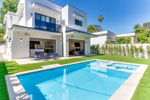 a house with a swimming pool in front of it at Posh Luxury Modern Home with Pool Spa and Rooftop Deck in Encino