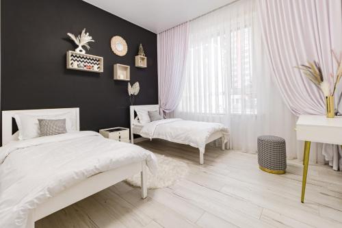 Ένα ή περισσότερα κρεβάτια σε δωμάτιο στο Шикарный Гостевой Guest Аpartments MURAGER