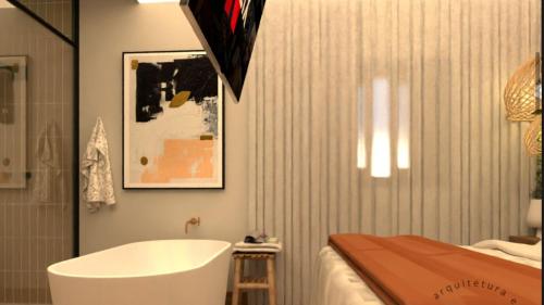 a bathroom with a bath tub next to a bed at Pousada Grão & Vinha in Espirito Santo Do Pinhal
