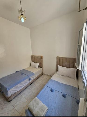 Postel nebo postele na pokoji v ubytování APPARTEMENT Blue