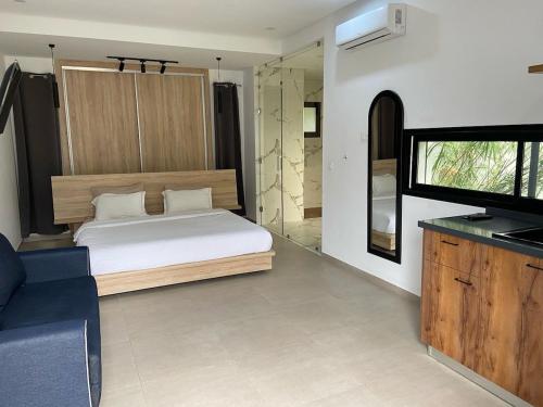 a bedroom with a bed and a tv in a room at Dar Aissa in El Maamoura