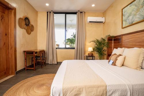 Postel nebo postele na pokoji v ubytování Villavida Boutique Hotel - La Playita