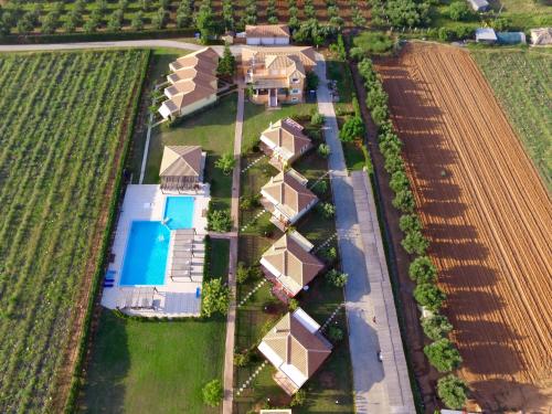 an overhead view of a row of houses in a field at Boutique Hotel Ileas Village in Arkoudi