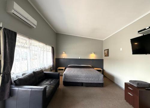 Postel nebo postele na pokoji v ubytování Central Court Motel