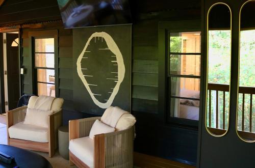 a room with two chairs and two windows at Modern Farmhouse at Montaluce Winery in Dahlonega