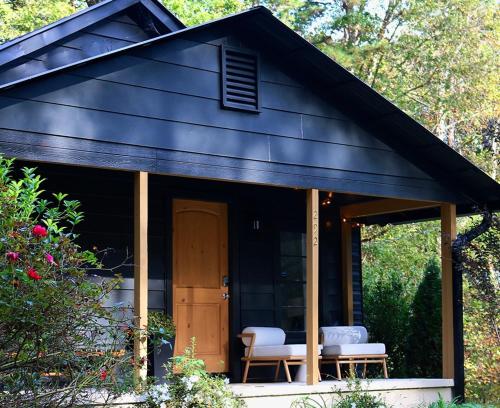 a gazebo with two chairs and a door at Modern Farmhouse at Montaluce Winery in Dahlonega