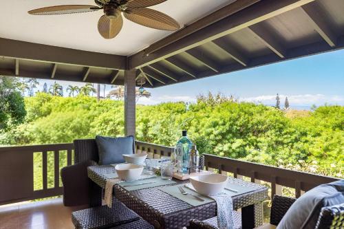 a patio with a table and chairs and a ceiling fan at Kaanapali Plantation 58 · KPL 58 Spacious 2BD Plantation Home Ne in Lahaina