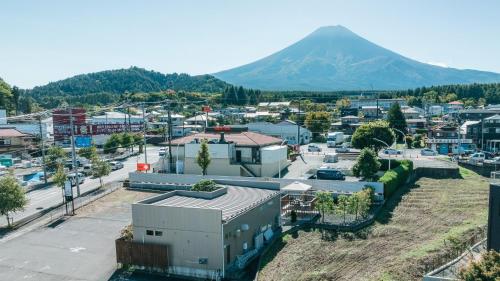 an aerial view of a city with a mountain in the background at Fuji Private Villa FUU-KUU in Fujiyoshida