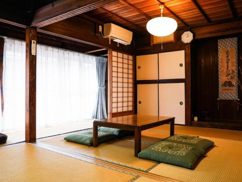 a living room with a table and a window at Kokoyui - Vacation STAY 06794v in Shimosato