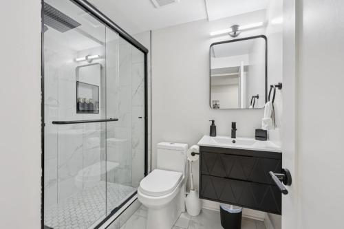 a bathroom with a shower and a toilet and a sink at City Hopper! in Washington