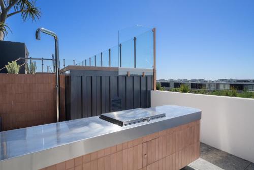 a tray on a ledge on a balcony at Stylish Studio Near Fremantle Cafés and Beaches in North Fremantle