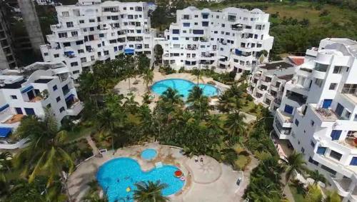 an aerial view of a resort with two swimming pools at Departamento en Club Casa Blanca, Same, Ecuador in Same