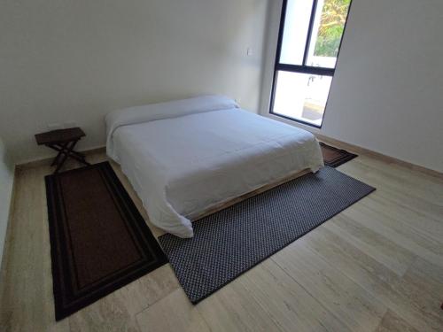 Ένα ή περισσότερα κρεβάτια σε δωμάτιο στο Acacias Residence