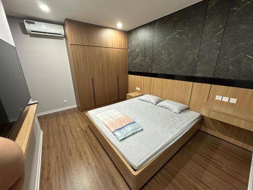 Ένα ή περισσότερα κρεβάτια σε δωμάτιο στο Binh Minh Garden Relax Apartment