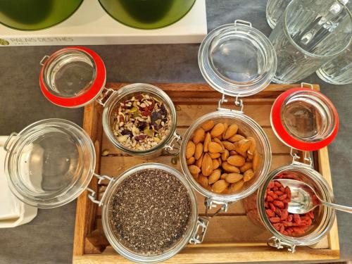 a tray of different types of spices and nuts at Mercure Aix-en-Provence La Duranne Gare TGV in Aix-en-Provence