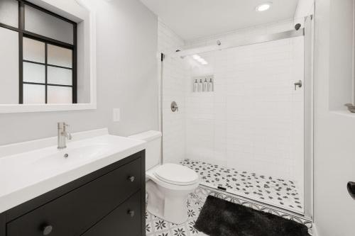 a white bathroom with a sink and a toilet at OldTown, Splash Pad & Park, Camelback Mountain trails, Desert Chic Retreat in Scottsdale