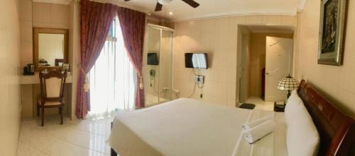 Postel nebo postele na pokoji v ubytování Emiramona Garden Hotel