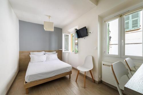 Ένα ή περισσότερα κρεβάτια σε δωμάτιο στο MARNE - Cosy studio in Menton
