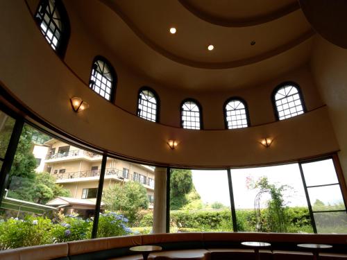 a building with large windows and a circular ceiling at Hakonenomori Okada in Hakone