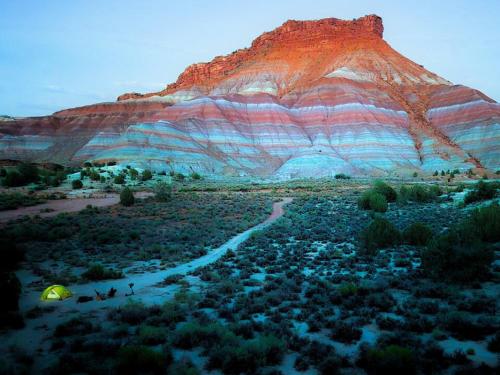 a tent in the desert with a mountain in the background at Campkit - Premium Camping Kit, Pickup in Kanab - Camp Anywhere in Kanab