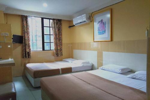 Katil atau katil-katil dalam bilik di 98 Inn BilikXpert at Chow Kit