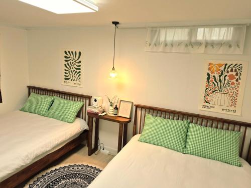 Postel nebo postele na pokoji v ubytování Sun Gangnam Stay - 무료짐보관,강남,언주역3분,신논현역,역삼역,대치,잠실,코엑스
