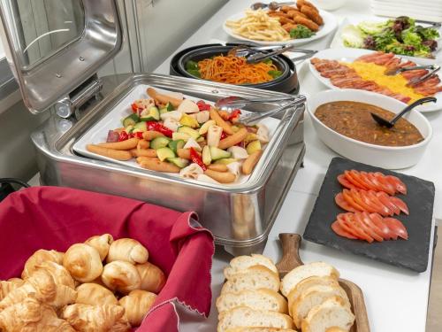 a table topped with lots of different types of food at Dream Village Kitakami in Kitakami