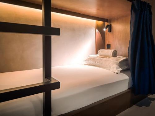 a bedroom with a large bed with at Yamato Hostel in Manila