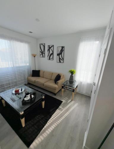 a living room with a couch and a table at Spacious Studio Living in Kansas City