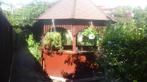 a gazebo in a garden with a fence at FKoka in Berehove