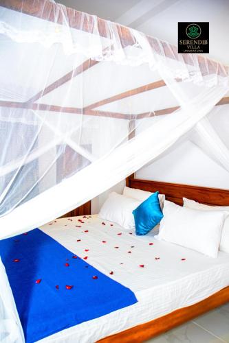 a bedroom with a loft bed with red hearts on it at Serendib villa unawatuna in Unawatuna