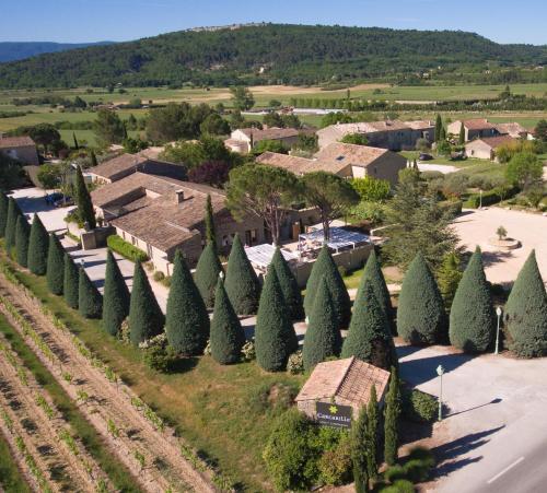 an aerial view of a subdivision with trees at Hôtel Carcarille Restaurant Le C in Gordes