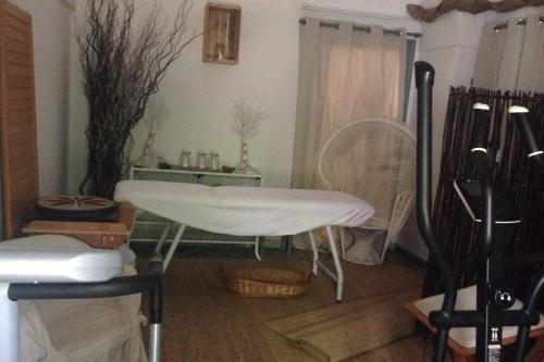 a living room with a table and a window at Dolce Farinella in Putignano
