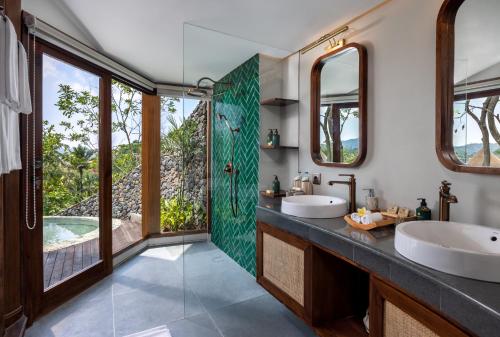 a bathroom with two sinks and a shower at The Wapa Lux Tent in Sidemen