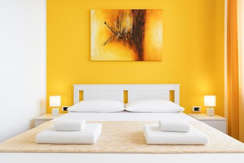 Postel nebo postele na pokoji v ubytování Iris Rooms