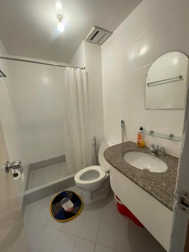 a bathroom with a toilet and a sink at Harmony Transient in Baguio