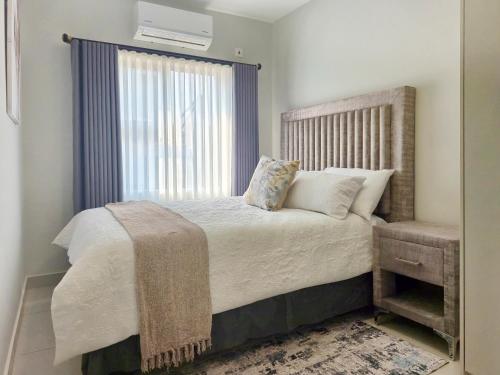 Ένα ή περισσότερα κρεβάτια σε δωμάτιο στο Tranquil Haven Suites