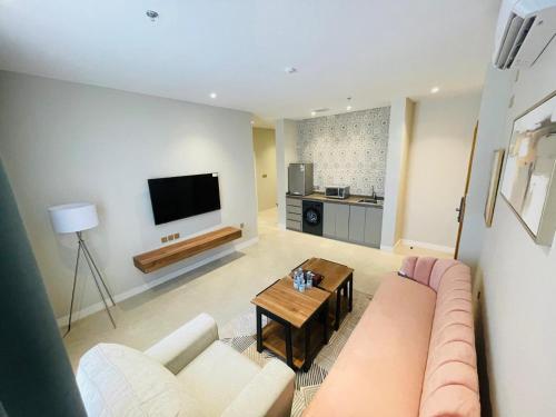 a living room with a couch and a table at Samt Residence - LUX apartments in Quai