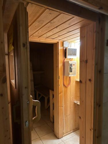 a small room with a door in a house at Ferienhaus im Wald in Edelschrott