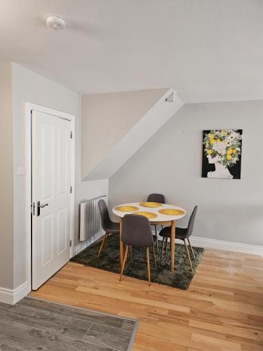 a dining room with a table and some chairs at Brogans Apartment in Trim