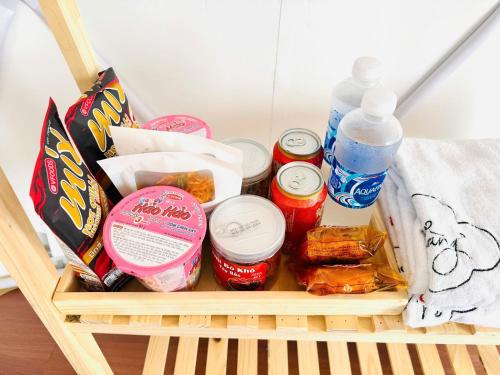 a basket filled with food and drinks on a table at Bamboo Homestay Tà Xùa in Bắc Yên