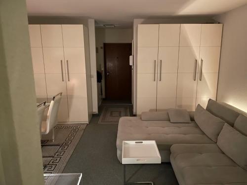 a living room with a couch and some cabinets at Skipper am Steinhuder Meer in Steinhude
