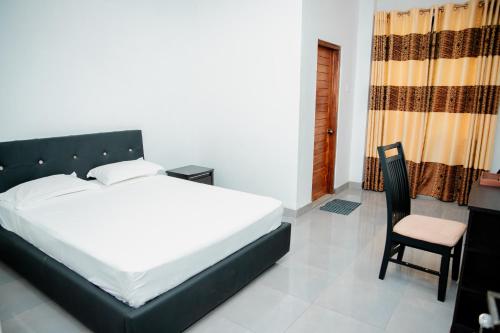 Postel nebo postele na pokoji v ubytování Lake Jay Hotel