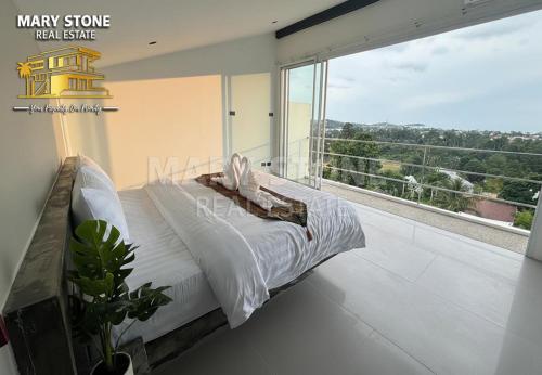 Postel nebo postele na pokoji v ubytování Charly Apartment - 2BR Seaview Cozy Apartment