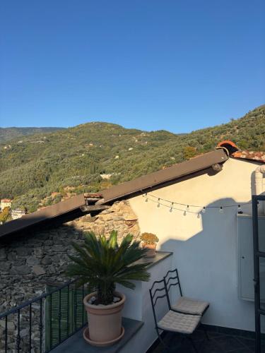a balcony with a view of a mountain at Iconic Italian Townhouse w Rooftop Terrace & Mountain View, Pigna in Pigna