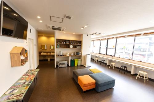 a living room with a couch and a table at Mezame Hostel in Nagasaki