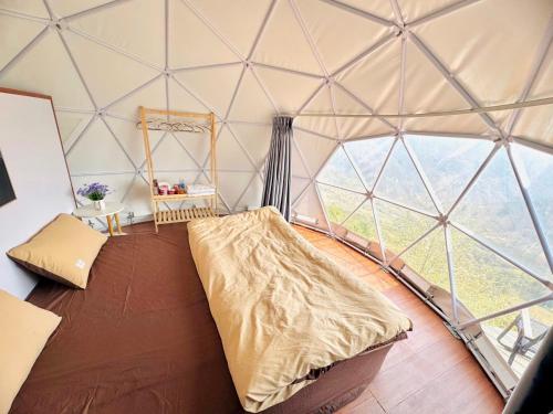 Postel nebo postele na pokoji v ubytování Bamboo Glamping Tà Xùa
